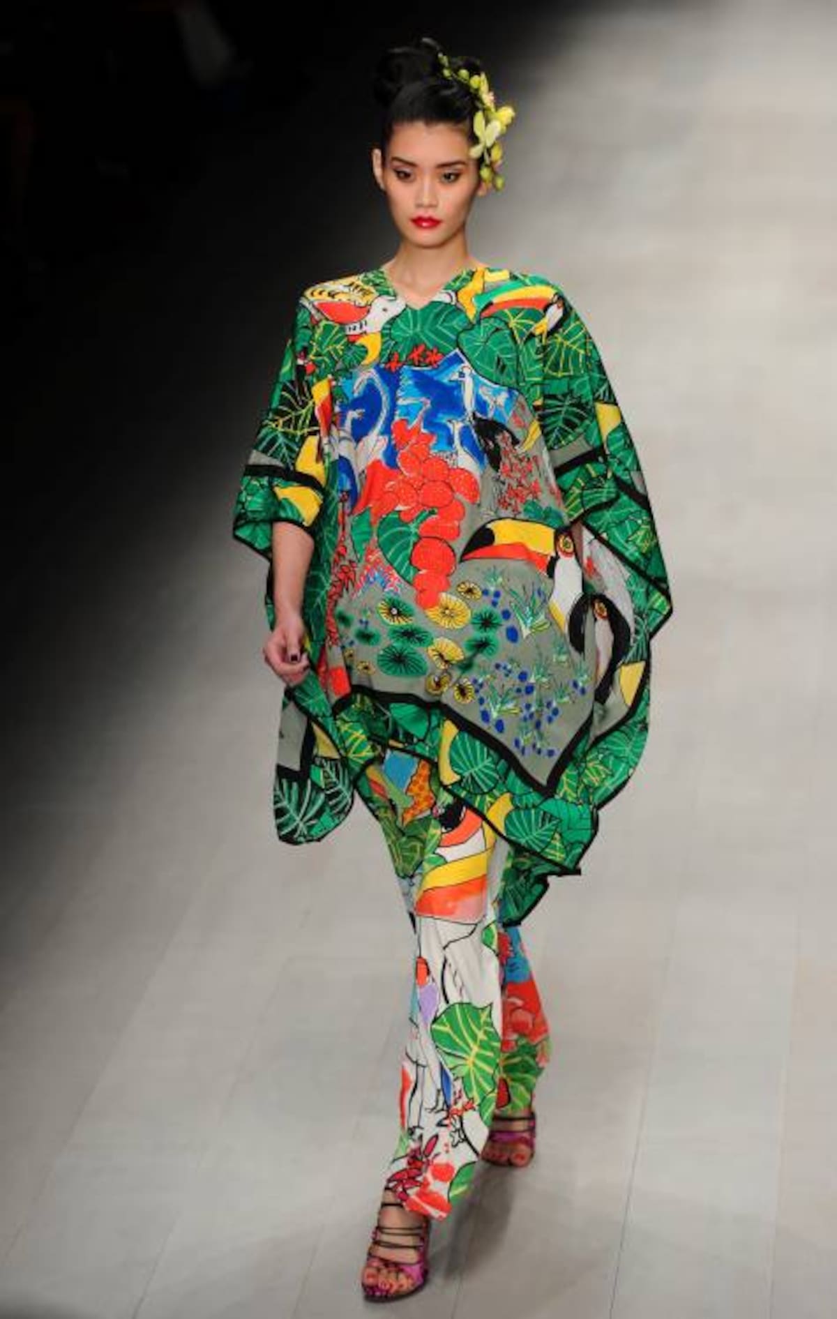 A model presents creations from the 2013 spring/summer collection of designer Issa London at London Fashion Week in London on September 15, 2012. AFP PHOTO / CARL COURT