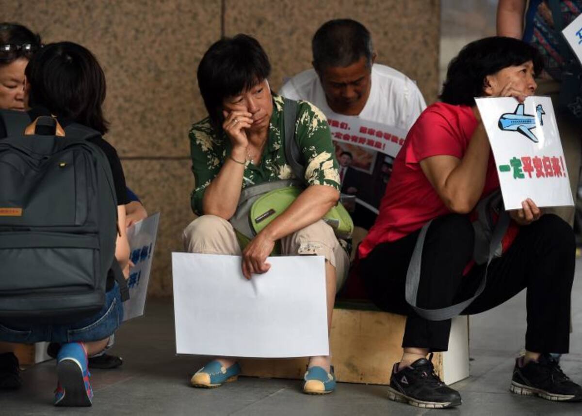 La mayoría de las familias se han negado a aceptar el veredicto de Malasia y esperan un análisis más definitivo y concluyente. AFP GREG BAKER