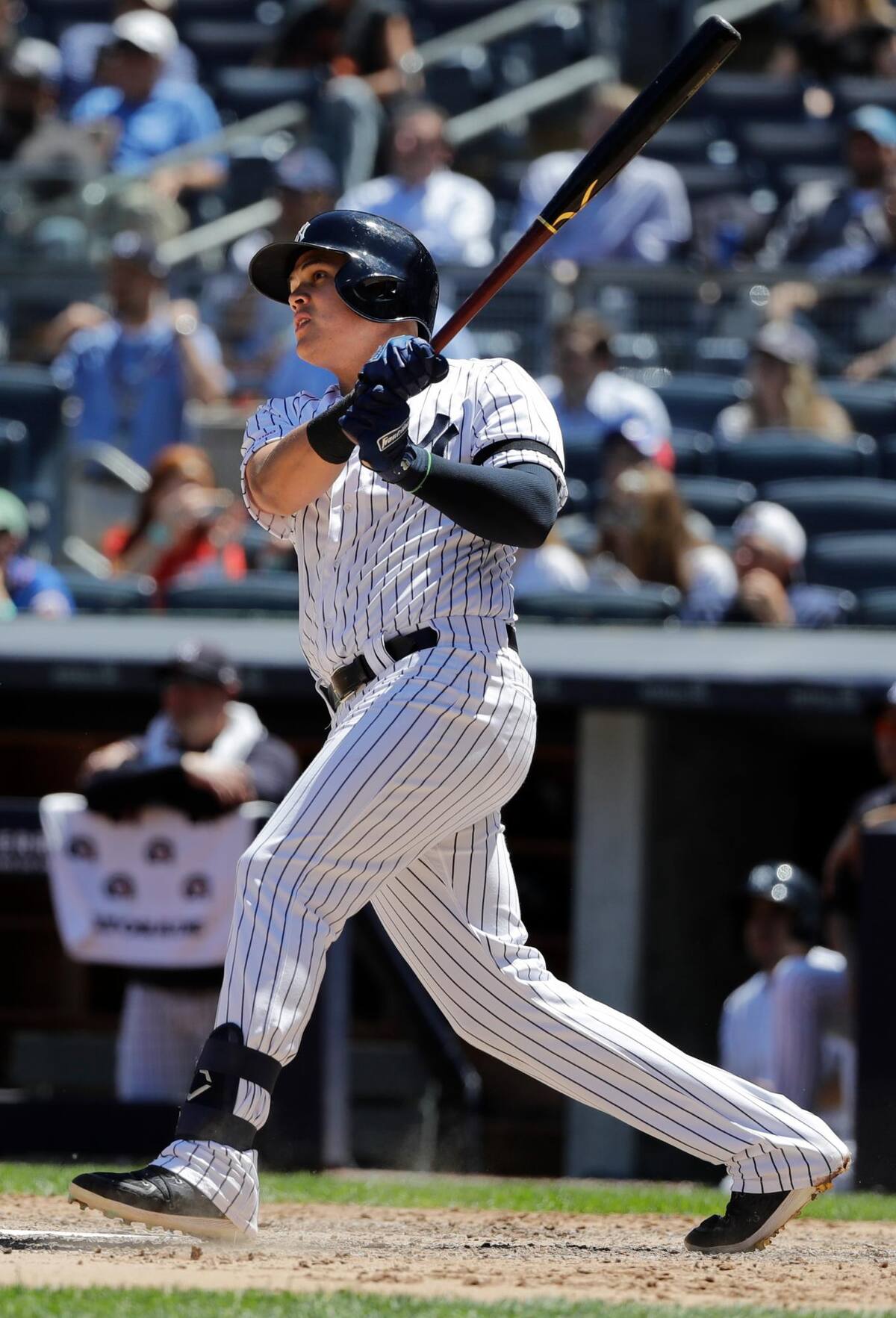 New York Yankees' Gio Urshela follows through on a two-run home run against the New York Mets during the fourth inning in the first baseball game of a doubleheader, Tuesday, June 11, 2019, in New York. (AP Photo/Frank Franklin II)