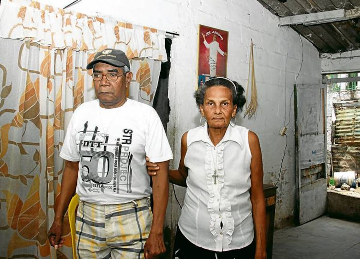 Aida Gueto, tía y madre adoptiva de Joe, y su esposo Julio César Ortega.