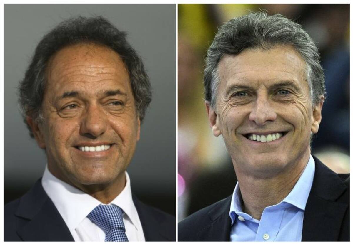 Daniel Scioli y Mauricio Macri. AFP PHOTO DESK