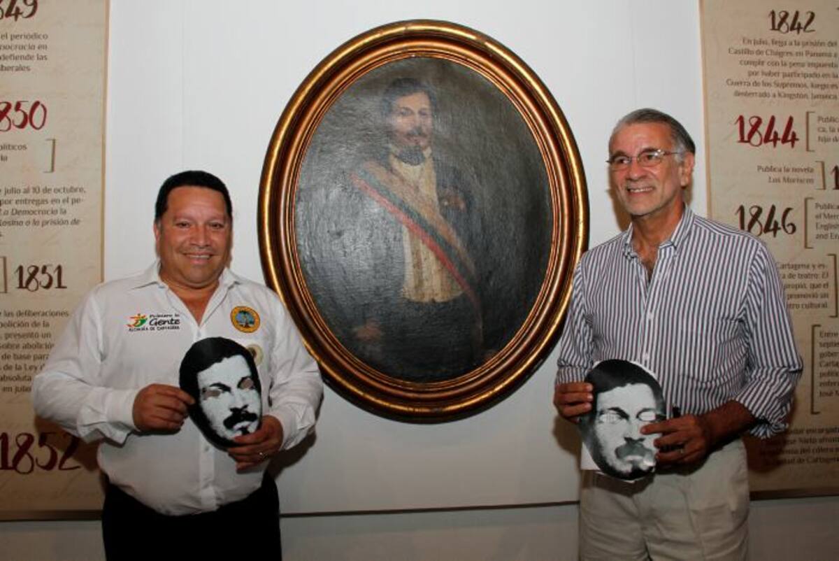 El gobernador del Atlántico, Eduardo Verano de la Rosa y el alcalde de Cartagena, Manuel Vicente Duque, al lado del cuadro de José Nieto. Maruja Parra/El Universal