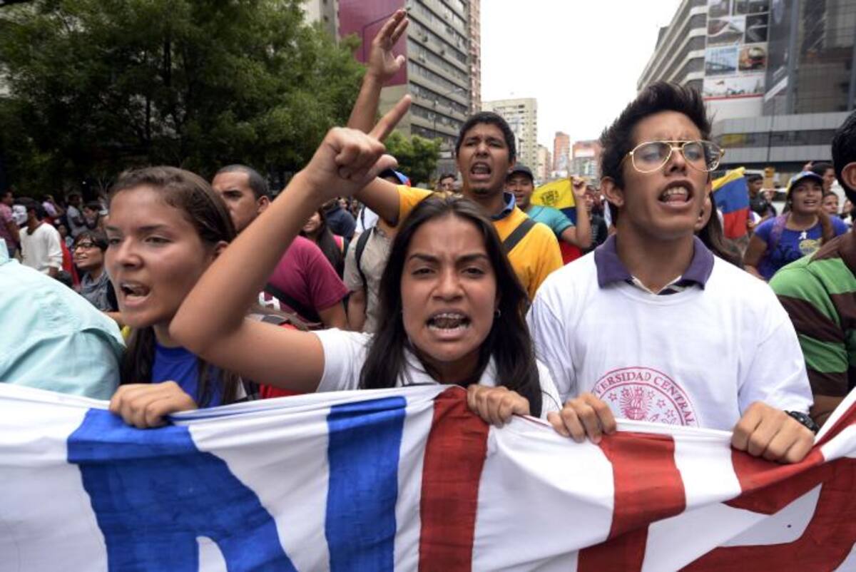 El diálogo de paz entre el gobierno venezolano y la oposición para negociar el fin de las protestas que han dejado 42 muertos, se mantuvo suspendido este lunes. AFP JUAN BARRETO