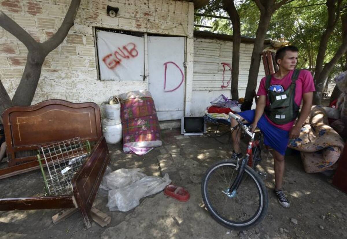 Con una "D" marcan las casas que van a ser demolidas. AFP LUIS ACOSTA