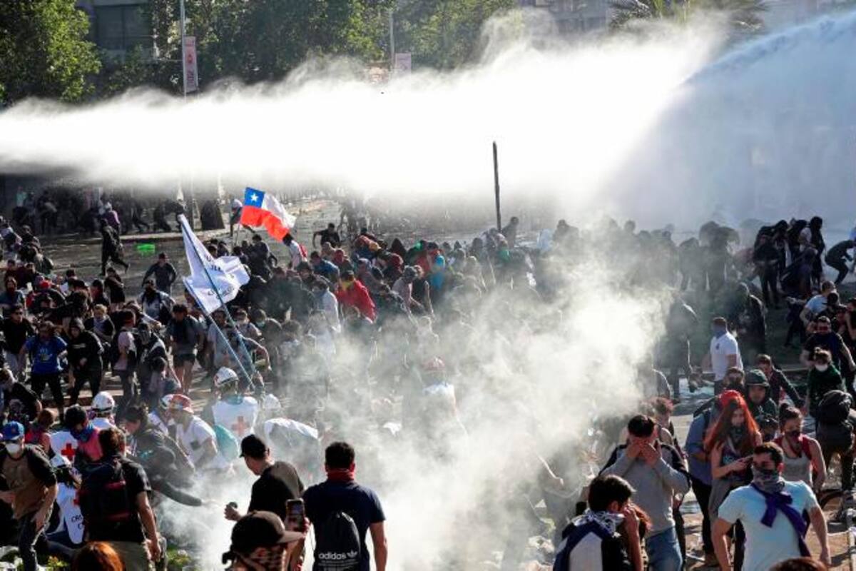 Un colombiano muerto y otro herido en protestas de Chile