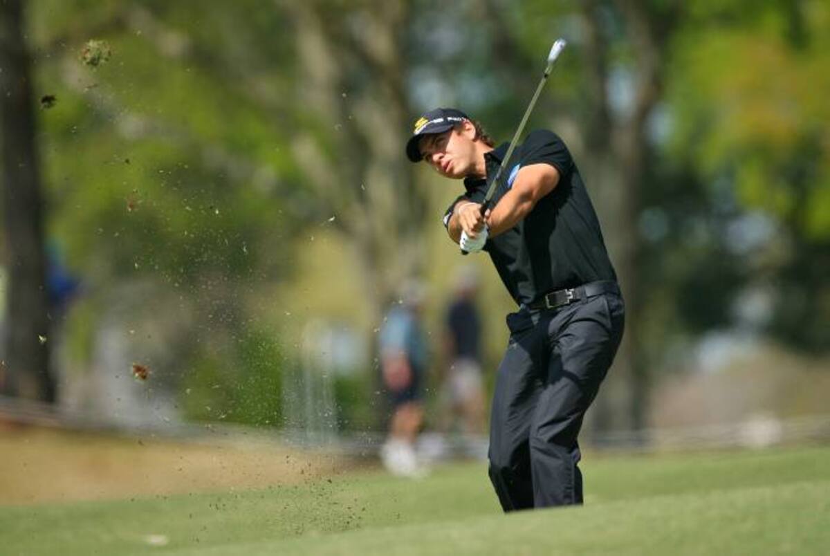 BROUSSARD, LA - MARCH 26: Manuel Villegas of Colombia hits his second shot on the 13th hole during the second round of the Chitimacha Louisiana Open at Le Triomphe Country Club on March 26, 2010 in Broussard, Louisiana. Hunter Martin/Getty Images/AFP== FOR NEWSPAPERS, INTERNET, TELCOS & TELEVISION USE ONLY ==