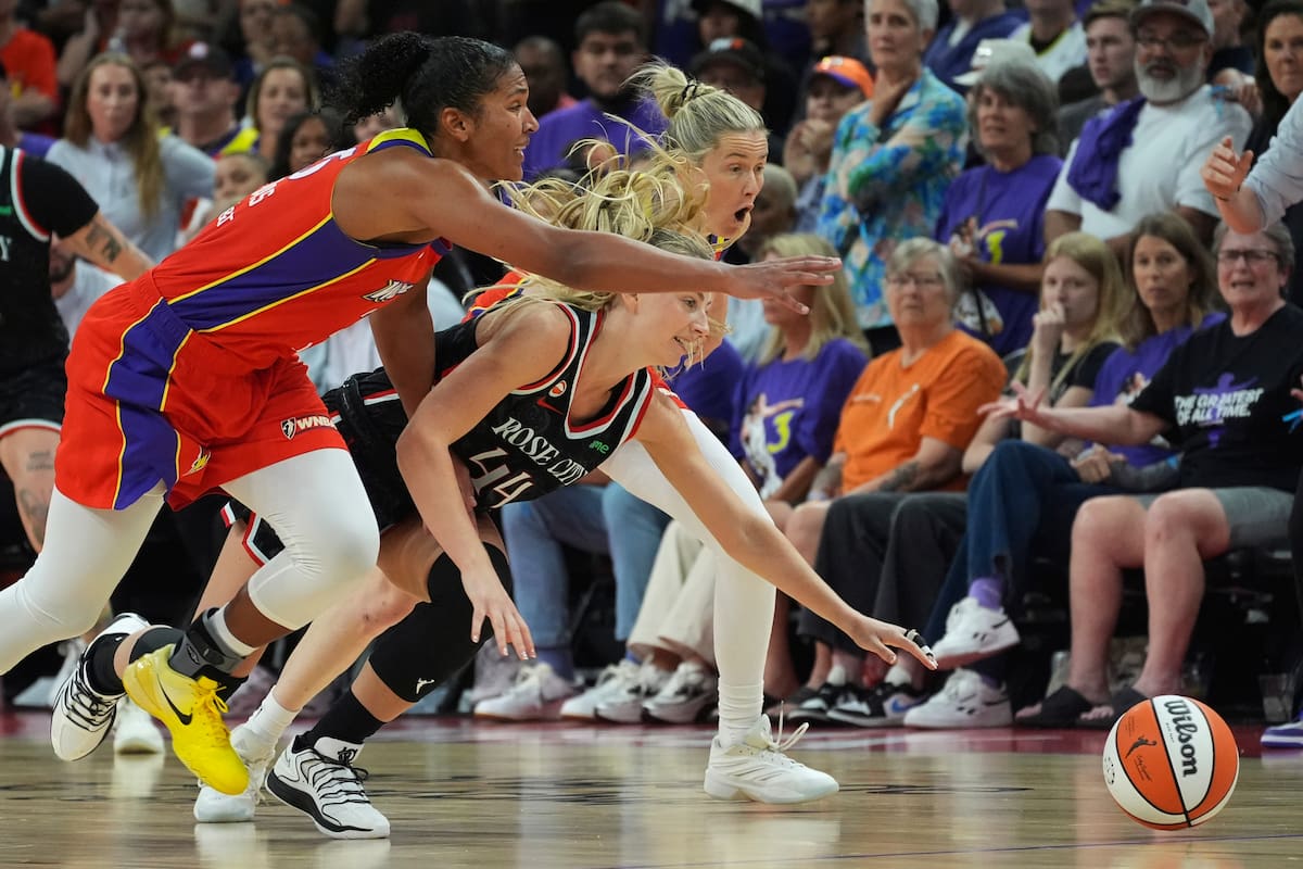 Phoenix Mercury forward Alyssa Thomas, left, Portland Fire guard Karlie Samuelson (44) and Mercury guard Sami Whitcomb run after a loose ball during the second half of a WNBA basketball game, Sunday, Aug. 16, 2026, in Phoenix. (AP Photo/Ross D. Franklin)