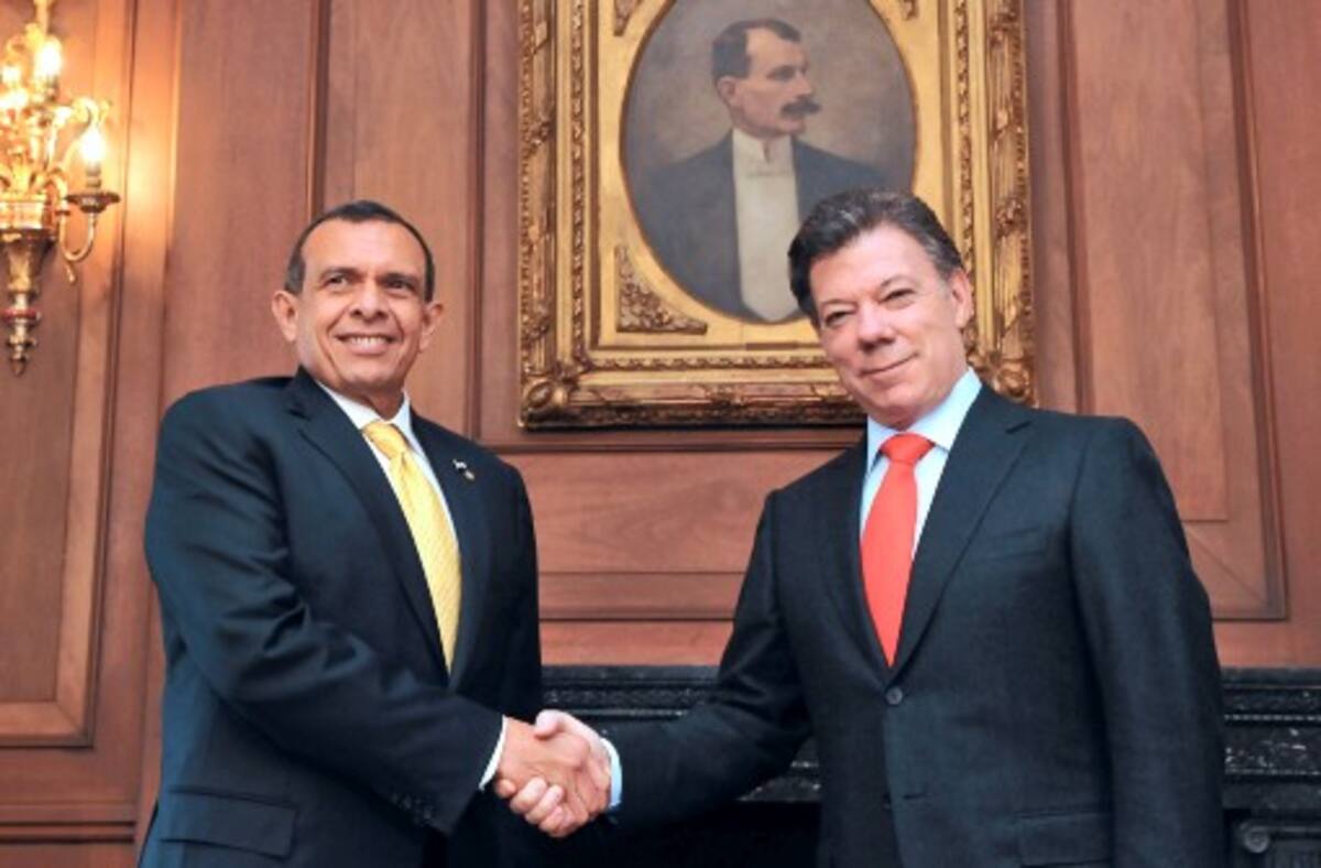 Juan Manuel santos y Porfirio Lobo COLPRENSA