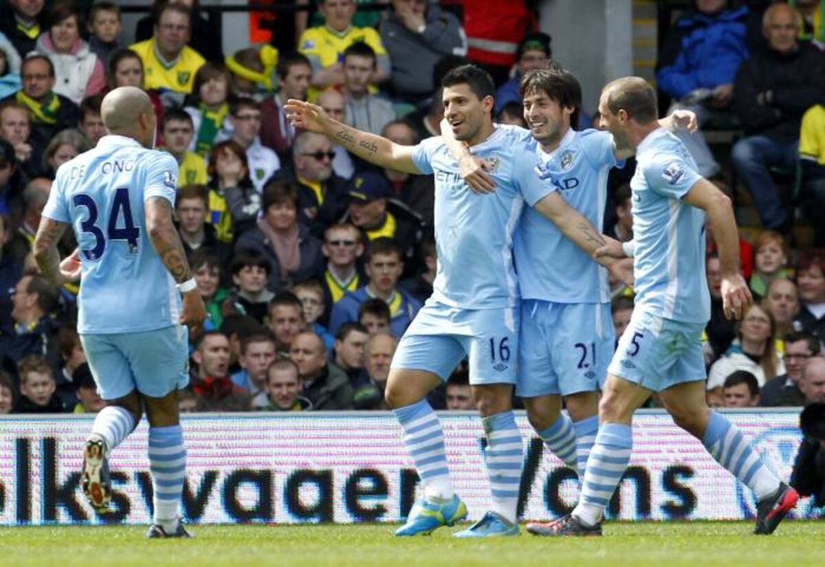 Juagadores del Manchester City celebrando uno de los goles ante el Norwich. AFP IAN KINGTON