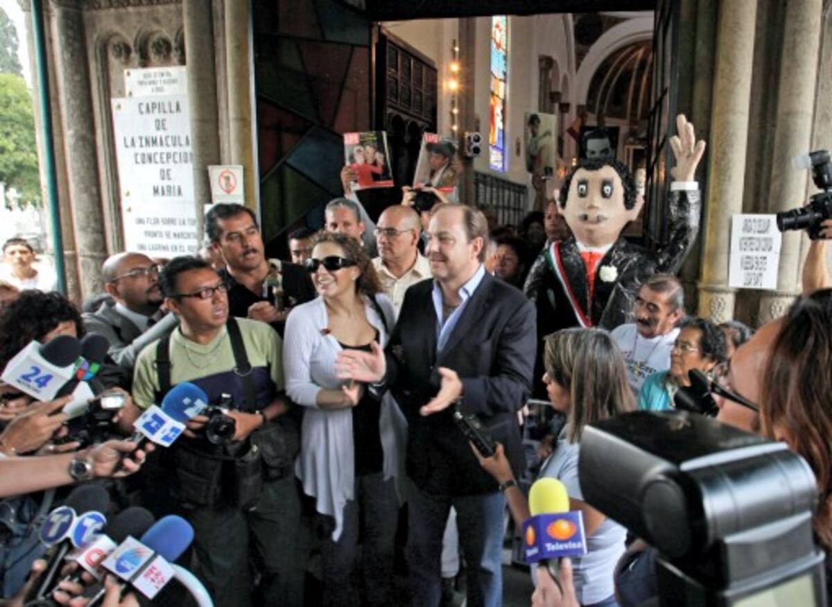 Mario Moreno, center, the adopted son of the late Mexican comedian and actor Mario Moreno known as "Cantinflas," leaves a ceremony marking his father's 100th birthday in Mexico City, Friday Aug. 12 2011. Considered by some as the Charlie Chaplin of Mexico, Moreno starred in 51 films and shorts, winning a Golden Globe for best comedy actor for his role in "Around the World in 80 Days," in 1957. (AP Photo/Arnulfo Franco)
