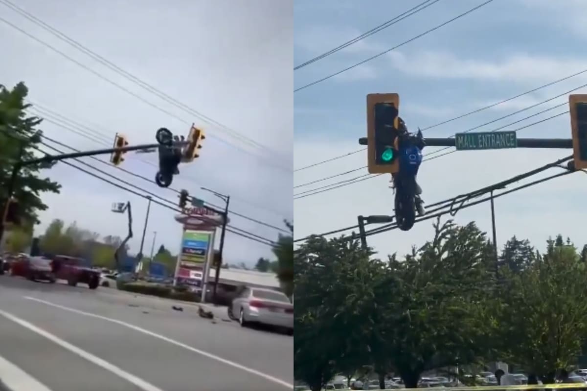 Una motocicleta quedó colgando en un semáforo tras un accidente. // Foto: captura de videos de El Tiempo @@ELTIEMPO.