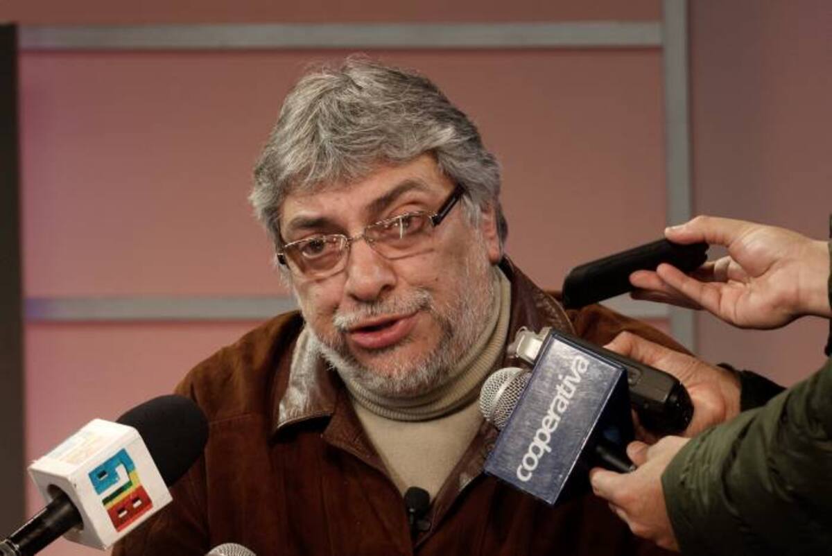 Paraguay's former President Fernando Lugo talks with reporters and through the open microphone of the Public Television in downtown Asuncion, Paraguay, in the early hours of Sunday, June 24, 2012. Lugo spoke in a pre-dawn special televised "open microphone" program hosted by the state-funded Public Television channel that was created by his government, to denounce his ouster as a "parliamentary coup". (AP Photo)