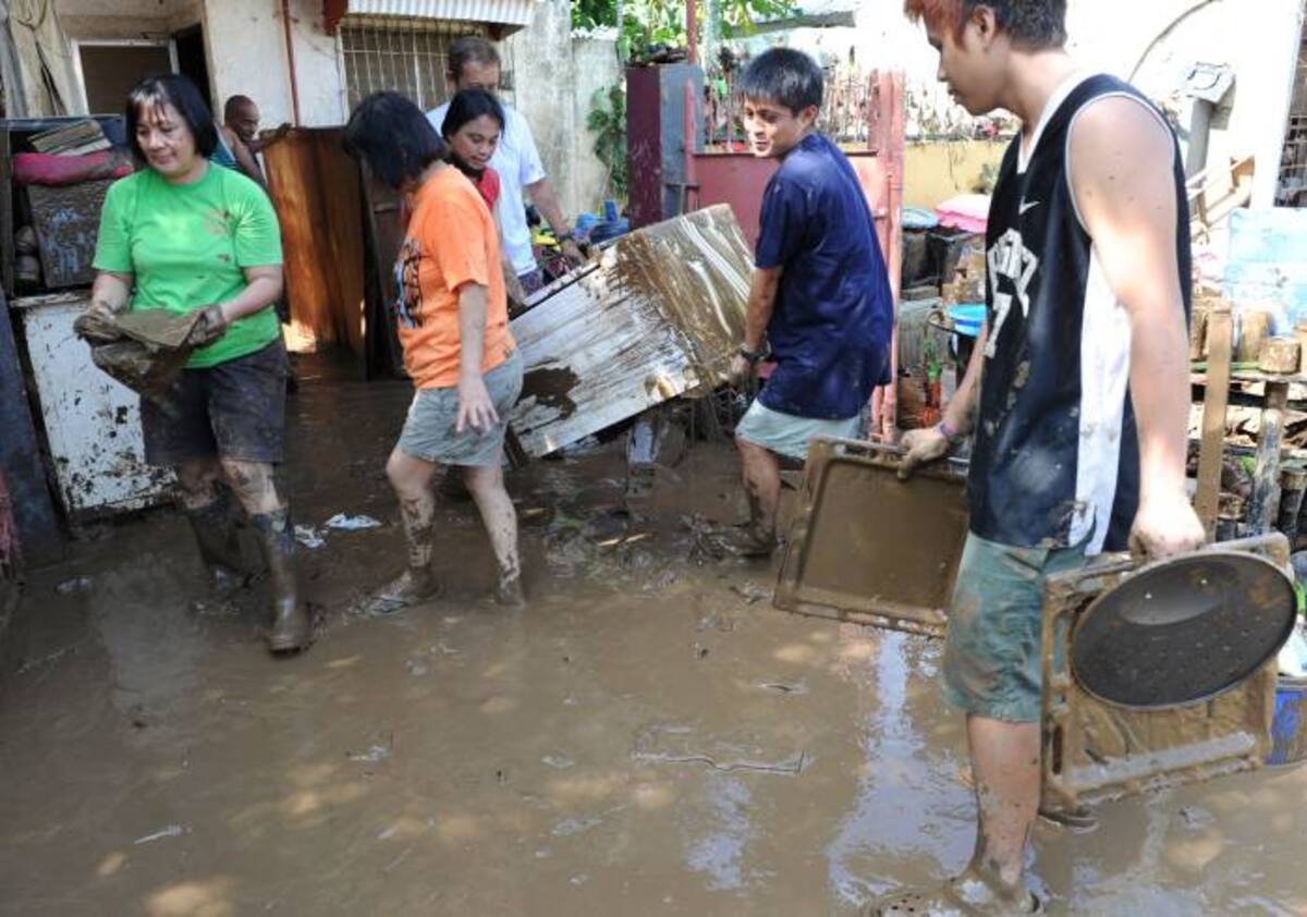Daños causados en Filipinas por la tormenta tropical Washi. AFP TED ALJIBE