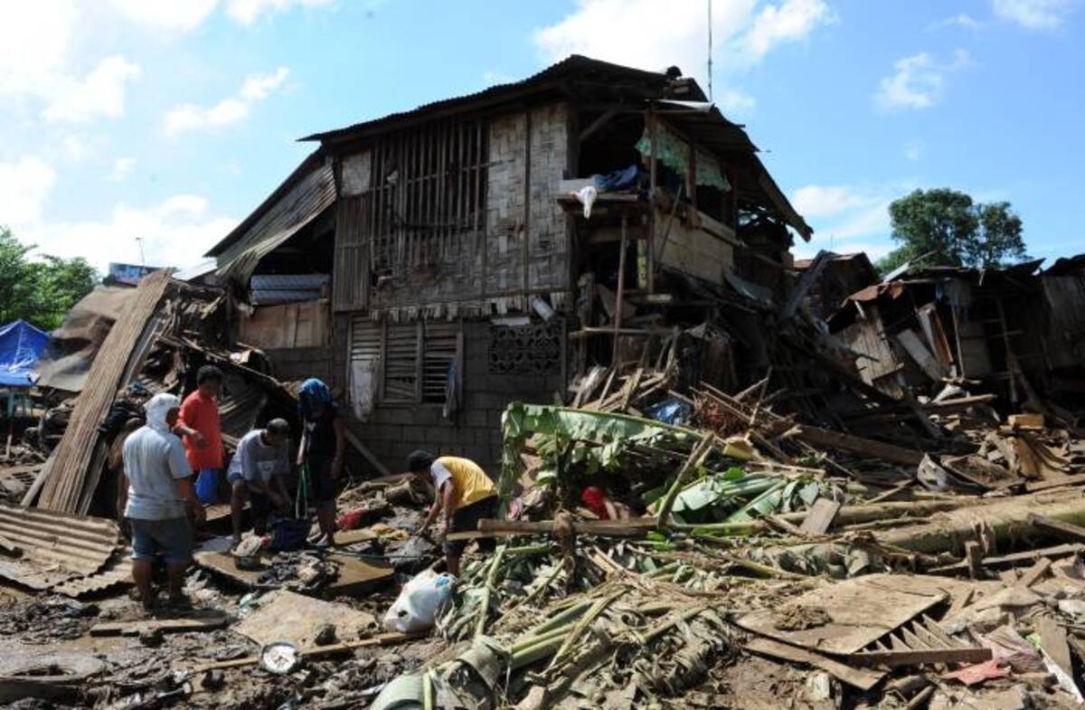 Daños causados en Filipinas por la tormenta tropical Washi. AFP TED ALJIBE