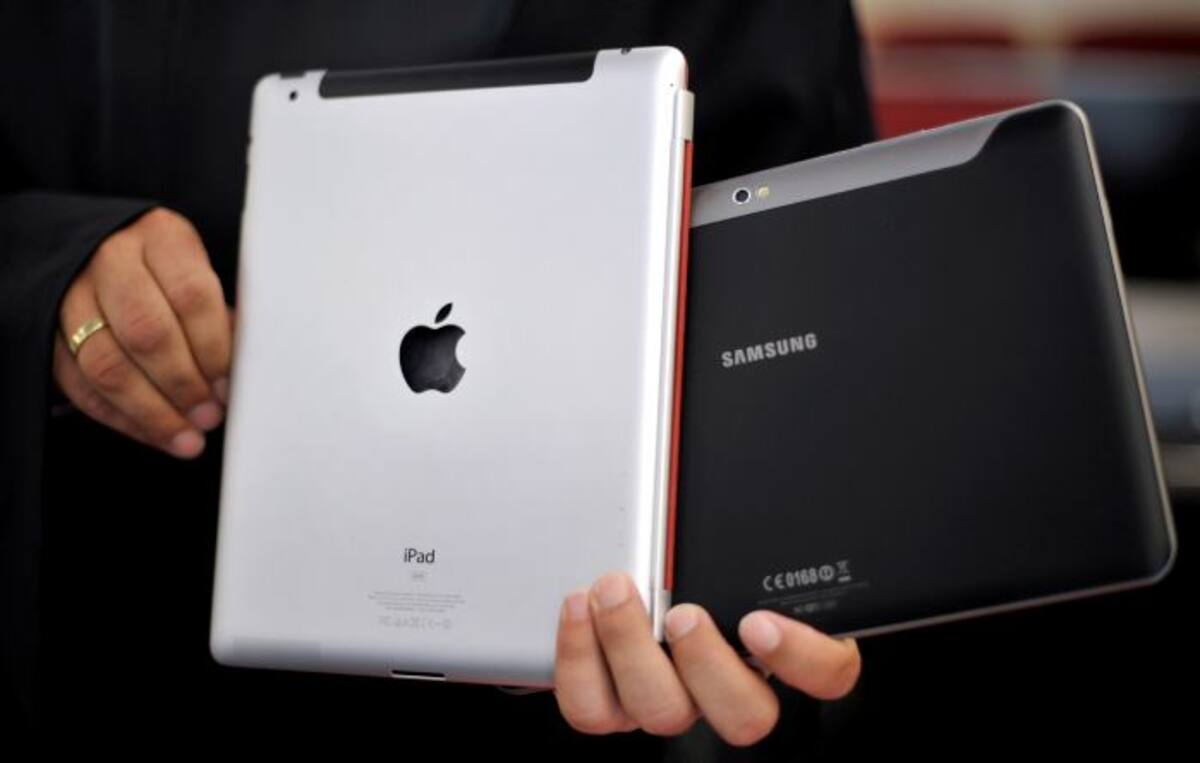 Apple y Samsung son dos fabricantes rivales que emprenden acciones legales entre si por patentes. AP Sascha Schuermann