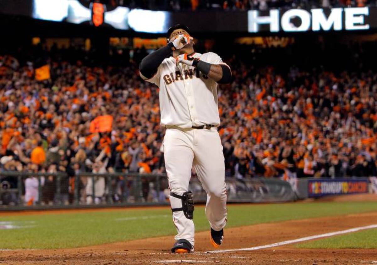 El equipo de San Francisco muestra como sus armas ofensivas a los venezolanos Marco Scutaro y Pablo Sandoval. AFP