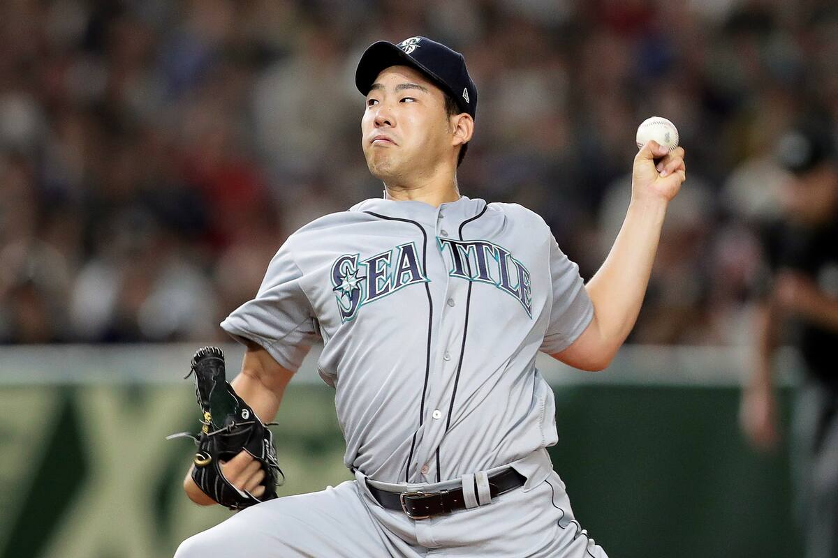 El lanzador japonés Yusei Kikuchi cuando lanzaba por los Marineros de Seattle. //EFE